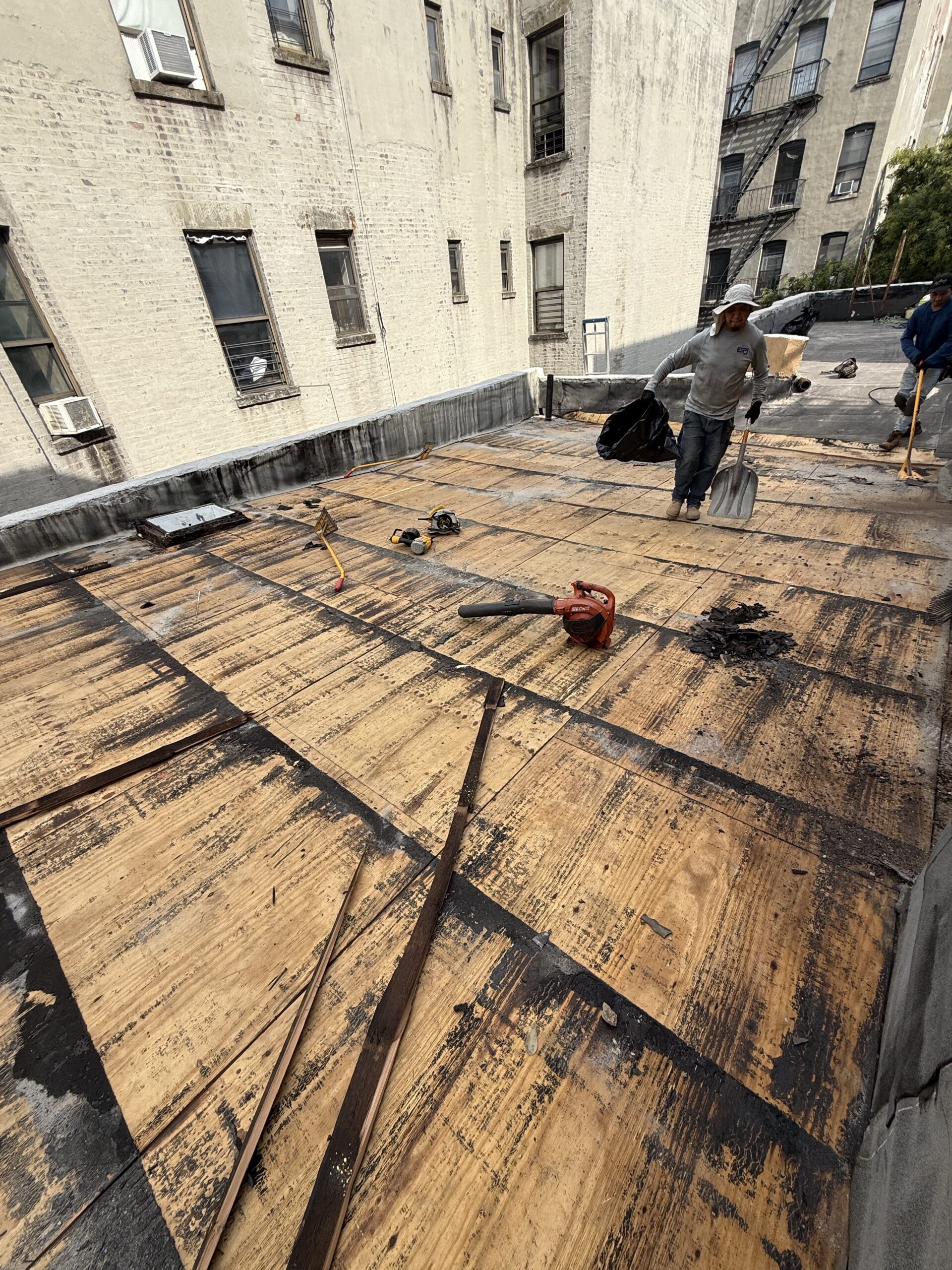 Roof tear off process revealing improper installation